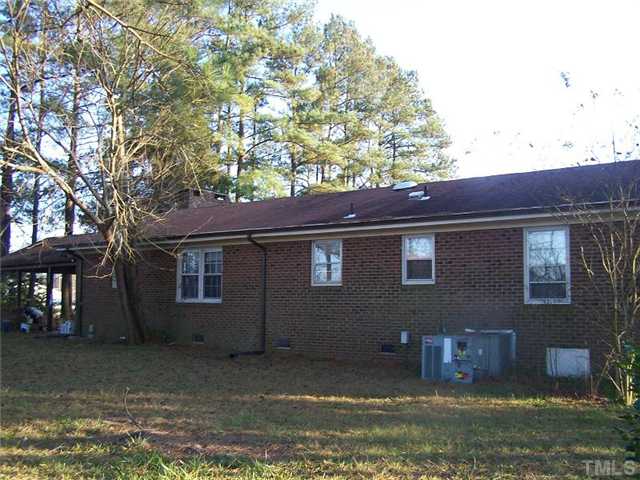 5848 Meadowbrook Road Benson, NC 27504 - Photo 2 of 4 a backyard of a house with lots of green space