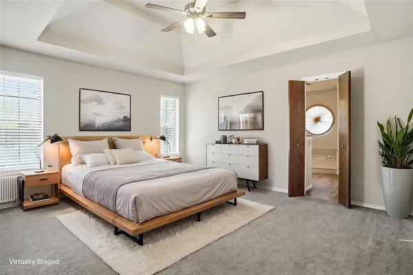 a bathroom with a tub and a mirror