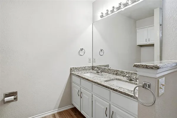 a front view of a house with a garden and patio