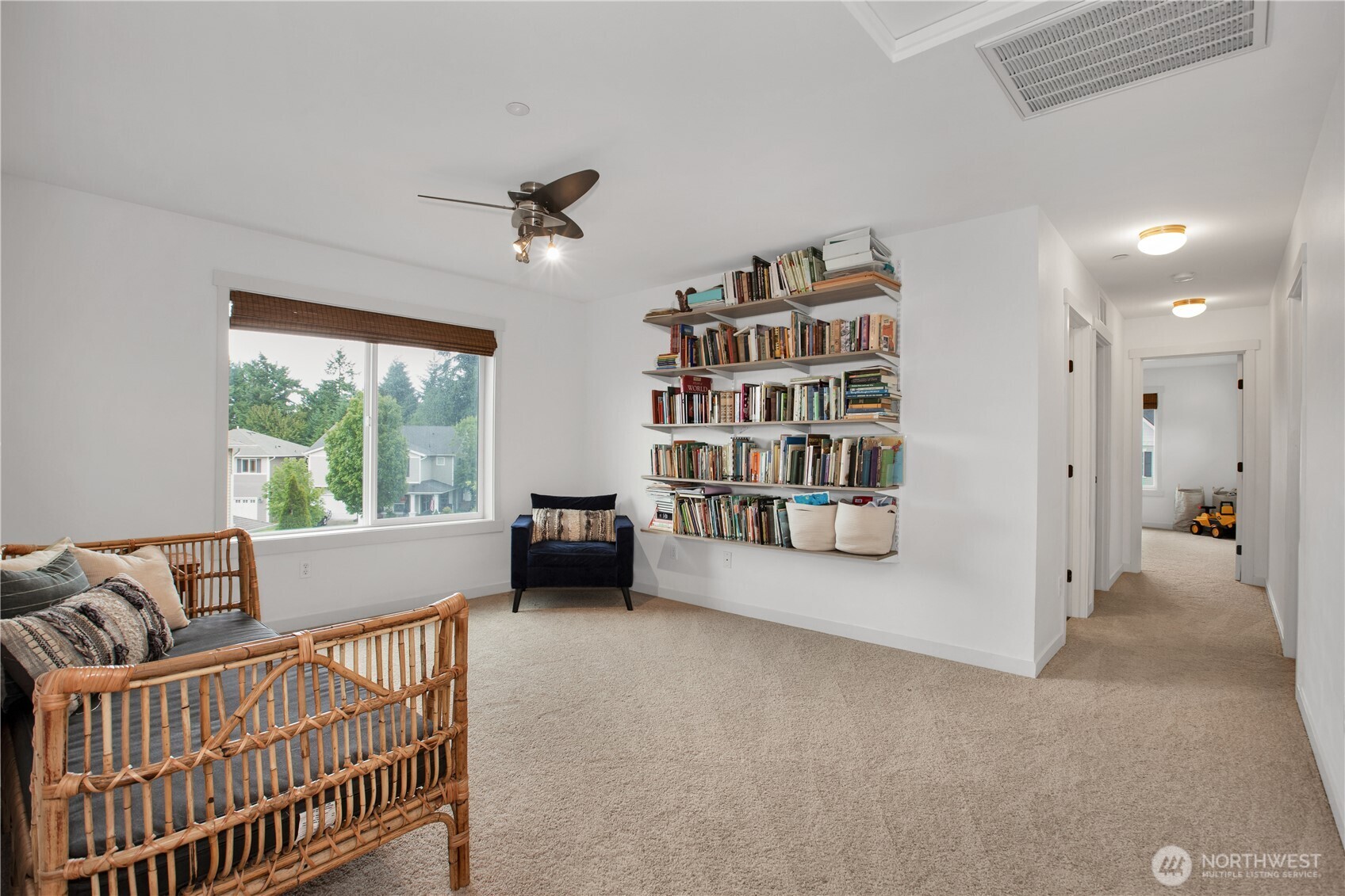 1344 Foreman Road DuPont, WA 98327 - Photo 20 of 40 a living room with furniture and a book shelf