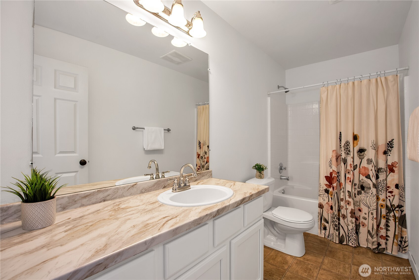 1344 Foreman Road DuPont, WA 98327 - Photo 23 of 40 a bathroom with a granite countertop sink a toilet and a mirror