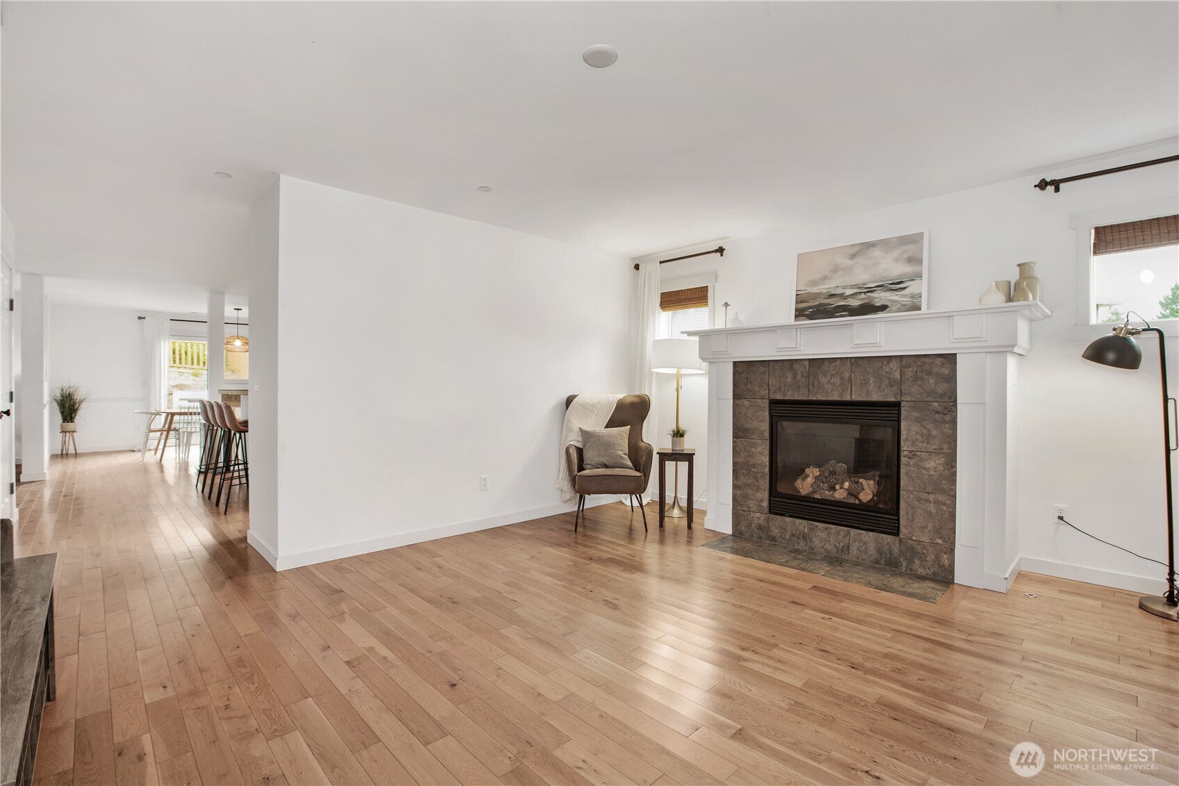 1344 Foreman Road DuPont, WA 98327 - Photo 3 of 40 a view of a livingroom with wooden floor and a fireplace