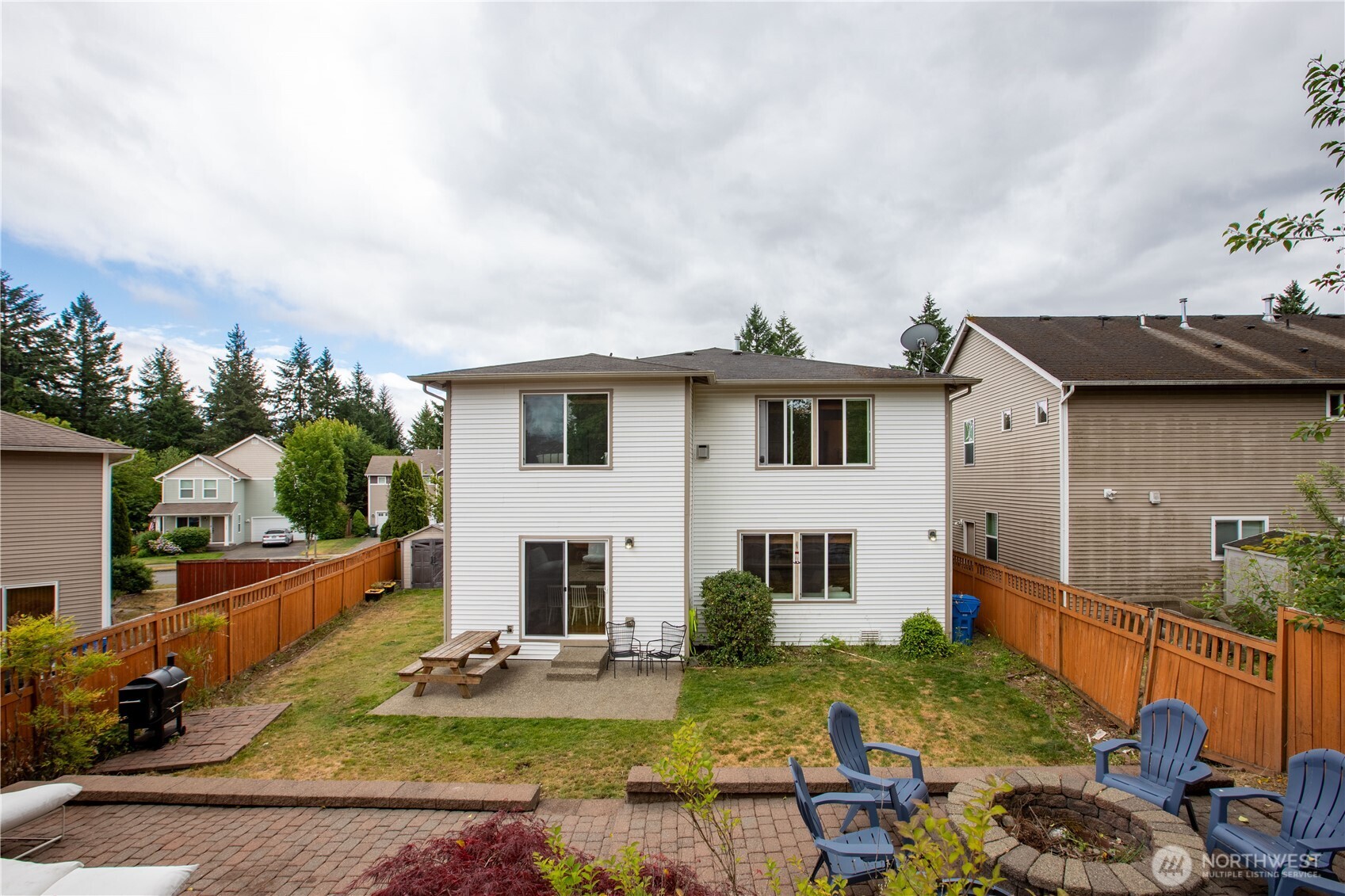 1344 Foreman Road DuPont, WA 98327 - Photo 37 of 40 a view of a house with backyard outdoor seating area and furniture