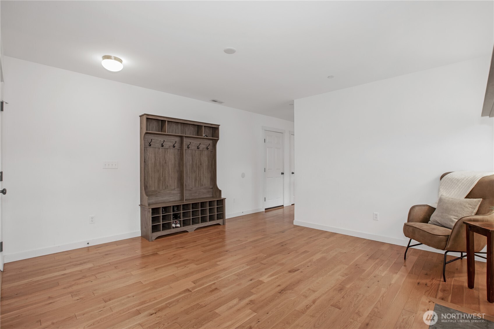 1344 Foreman Road DuPont, WA 98327 - Photo 8 of 40 a view of an empty room with wooden floor and a window
