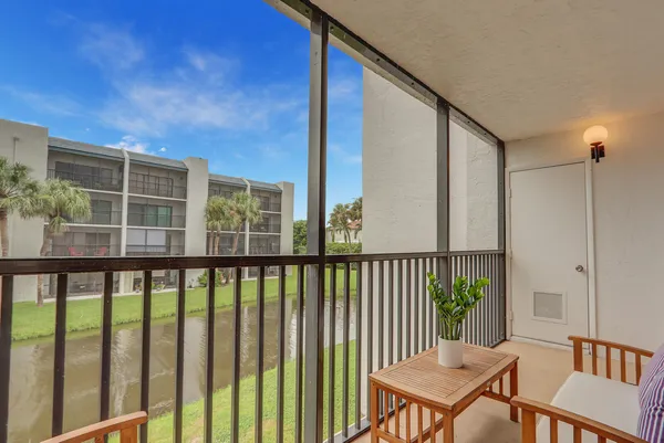 a view of a balcony with furniture