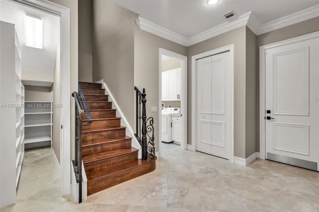 a view of wooden floor and windows in a room