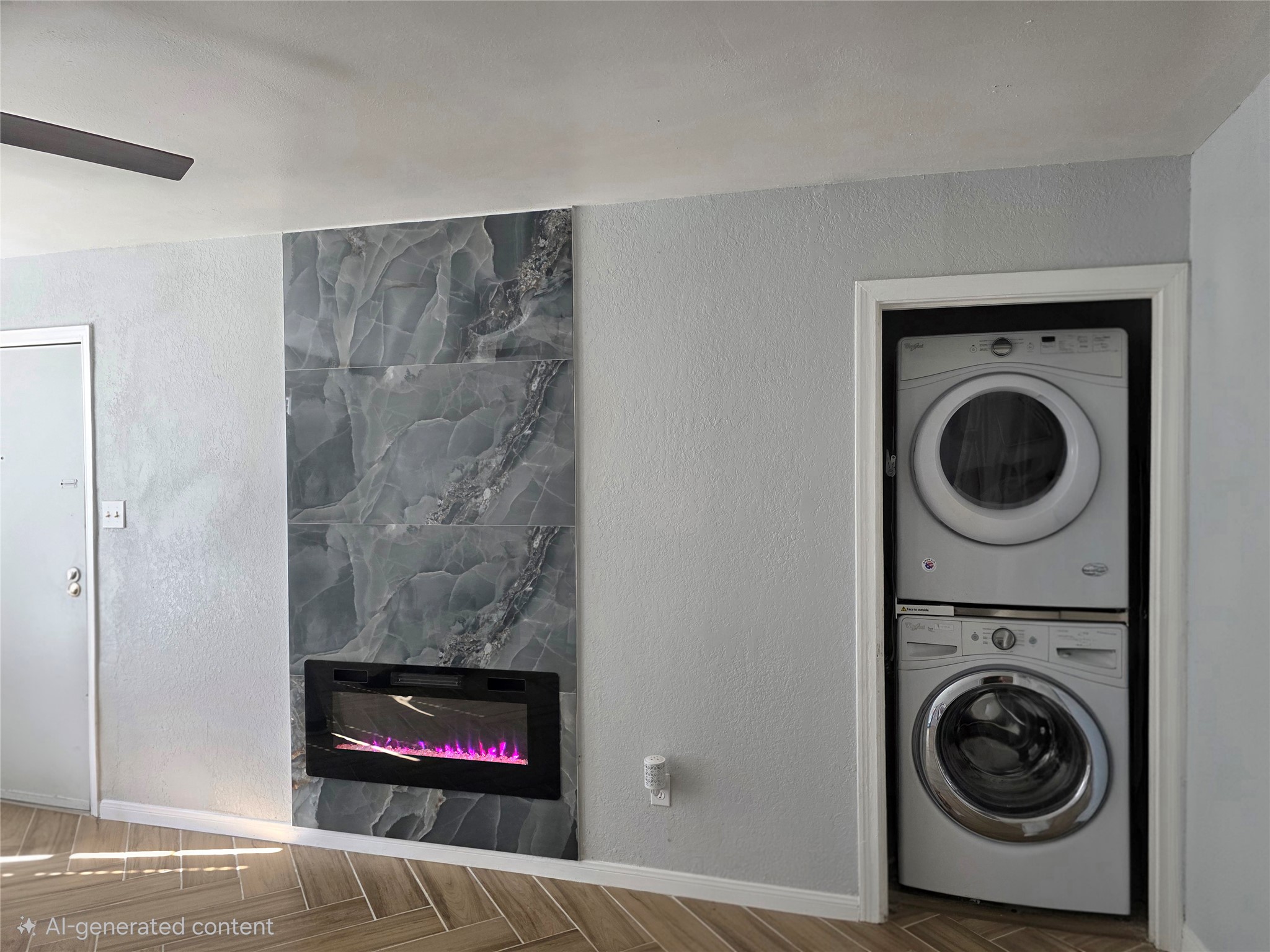 805 Sissom Road Killeen, TX 76541 - Photo 28 of 35 Laundry area with parquet floors, a textured wall, stacked washing machine and dryer, and a premium fireplace
