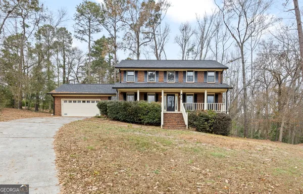 a front view of a building with a road