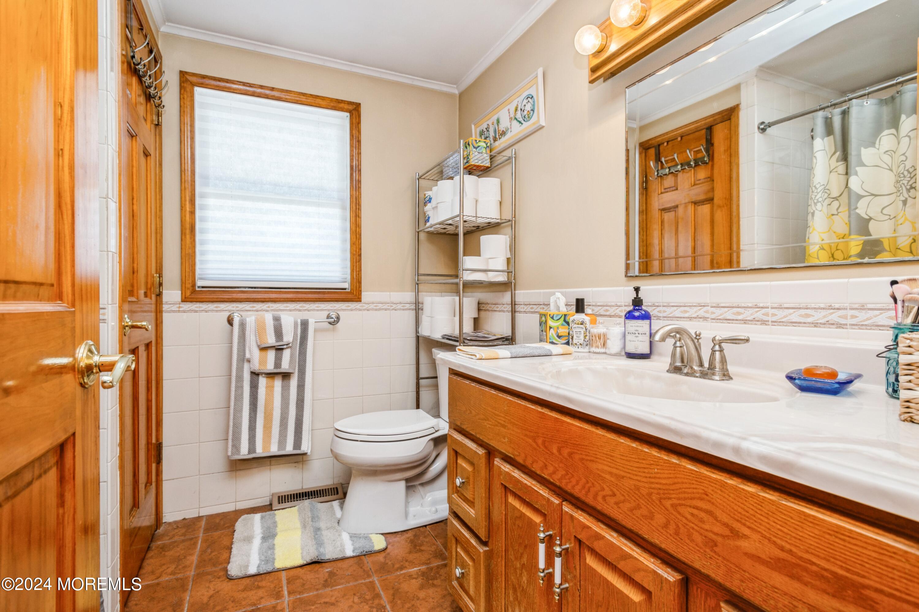 151 Cassville Road Jackson, NJ 08527 - Photo 14 of 14 a bathroom with a granite countertop sink and a mirror