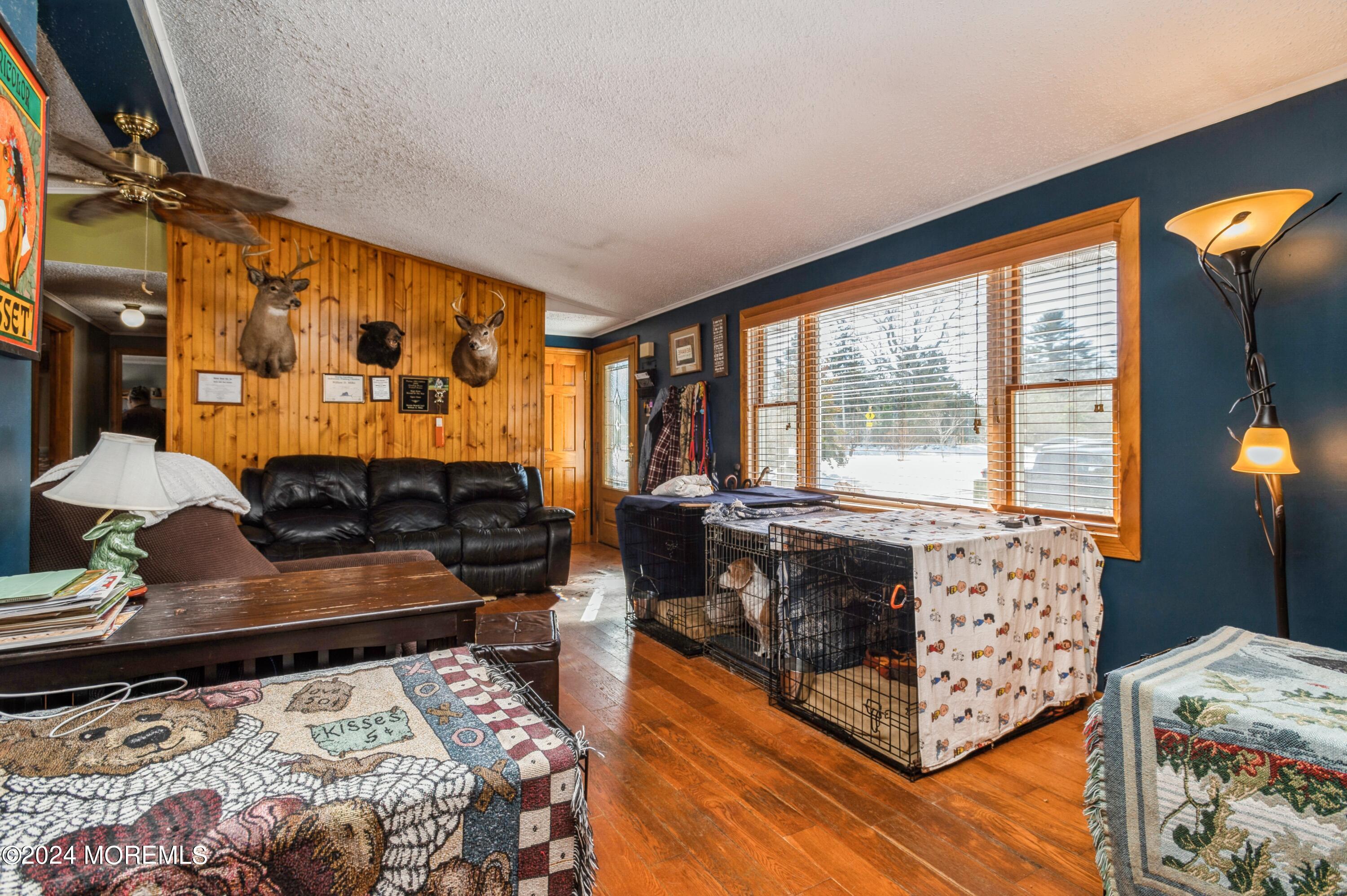 151 Cassville Road Jackson, NJ 08527 - Photo 5 of 14 a living room with furniture and a flat screen tv
