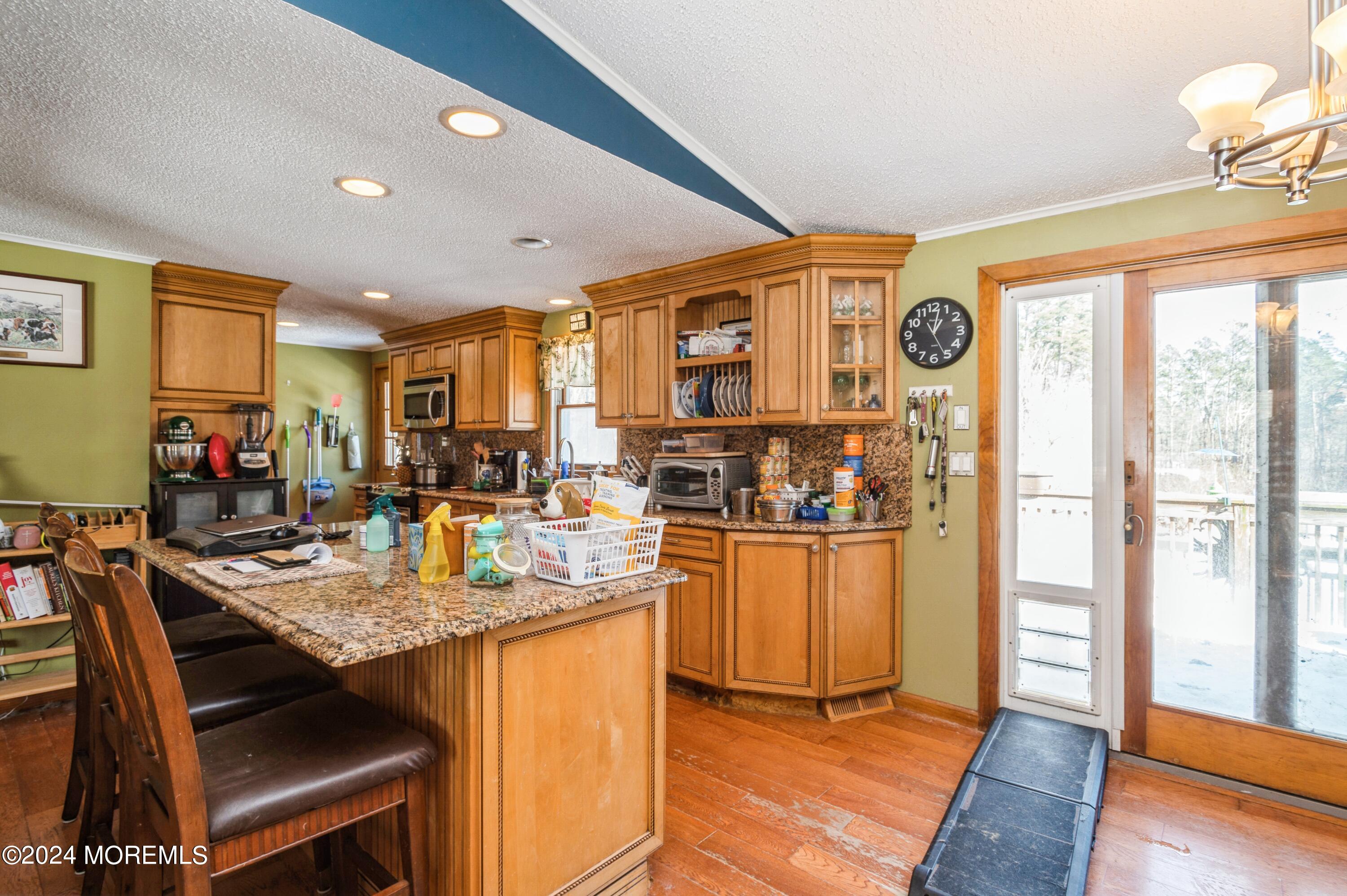 151 Cassville Road Jackson, NJ 08527 - Photo 6 of 14 a open kitchen with stainless steel appliances granite countertop a stove and refrigerator