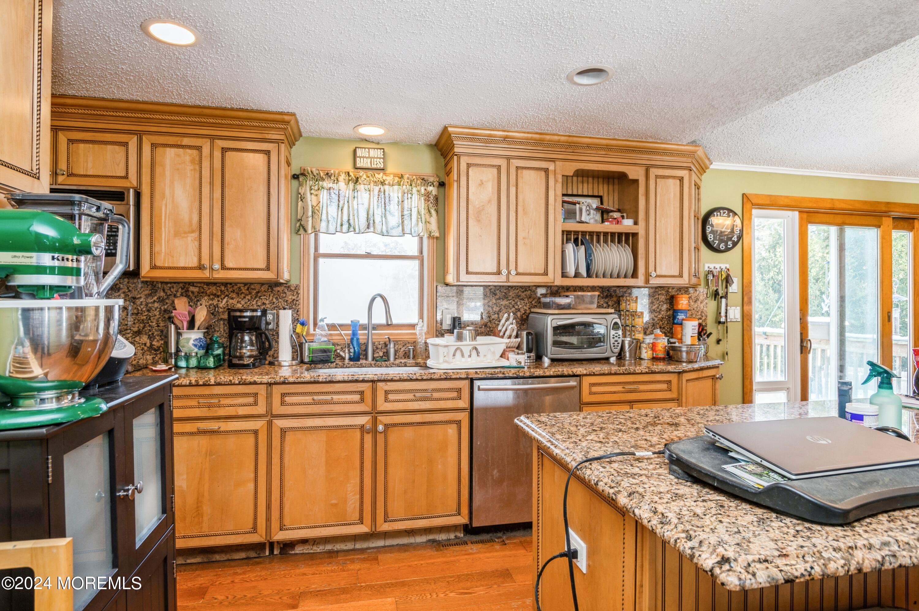 151 Cassville Road Jackson, NJ 08527 - Photo 8 of 14 a kitchen with stainless steel appliances granite countertop a stove a sink and a microwave