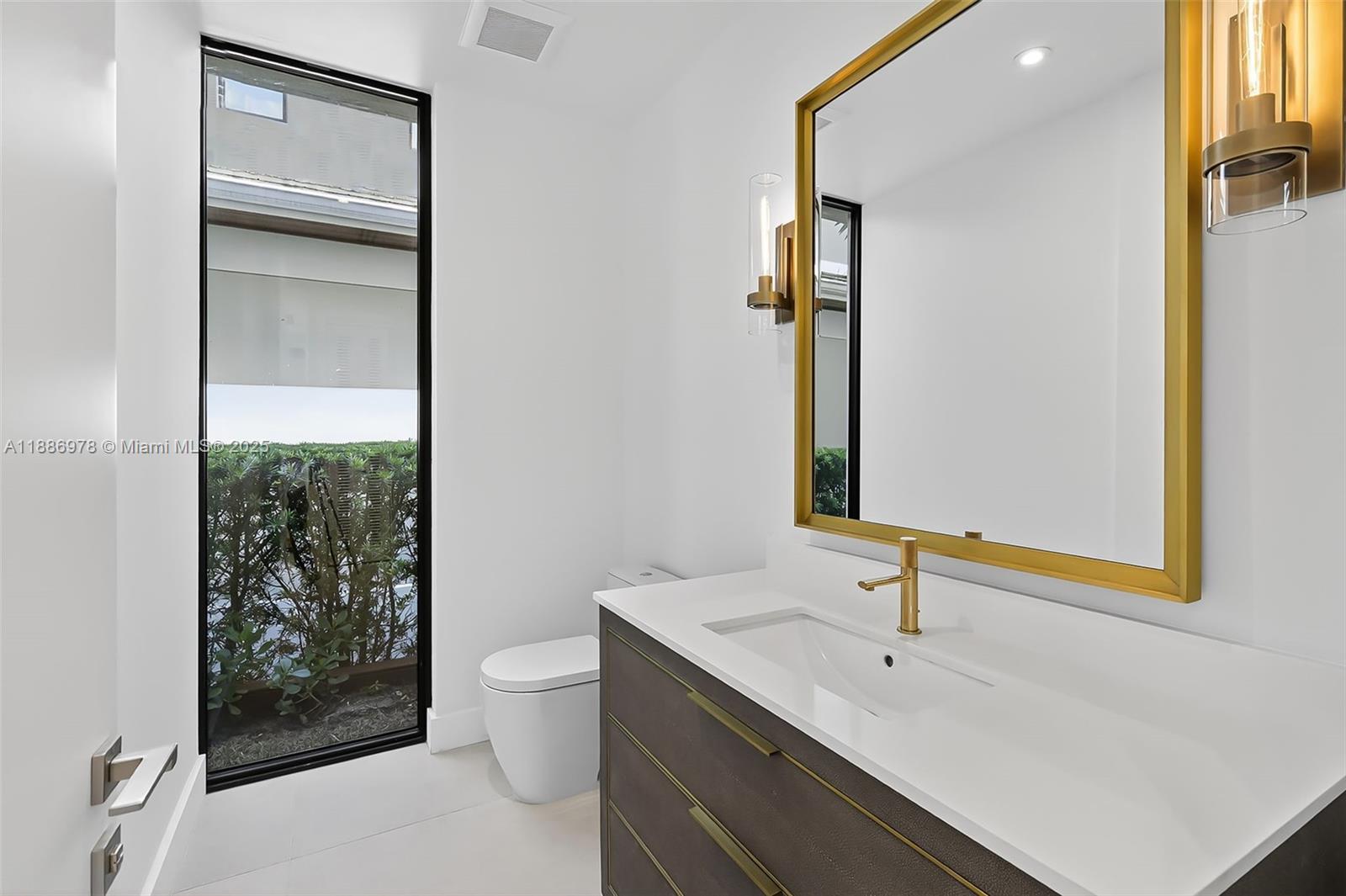 620 Solar Isle Drive Fort Lauderdale, FL 33301 - Photo 35 of 83 a bathroom with a sink a toilet and shower