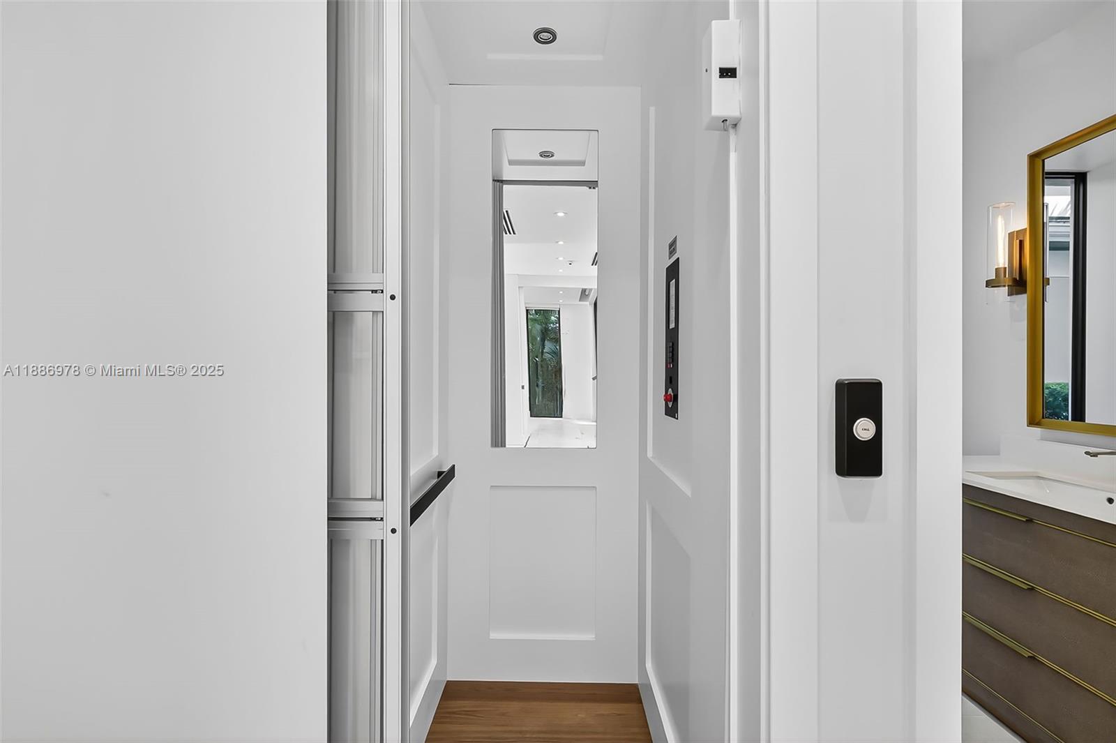 620 Solar Isle Drive Fort Lauderdale, FL 33301 - Photo 36 of 83 a view of a hallway with wooden floor and staircase