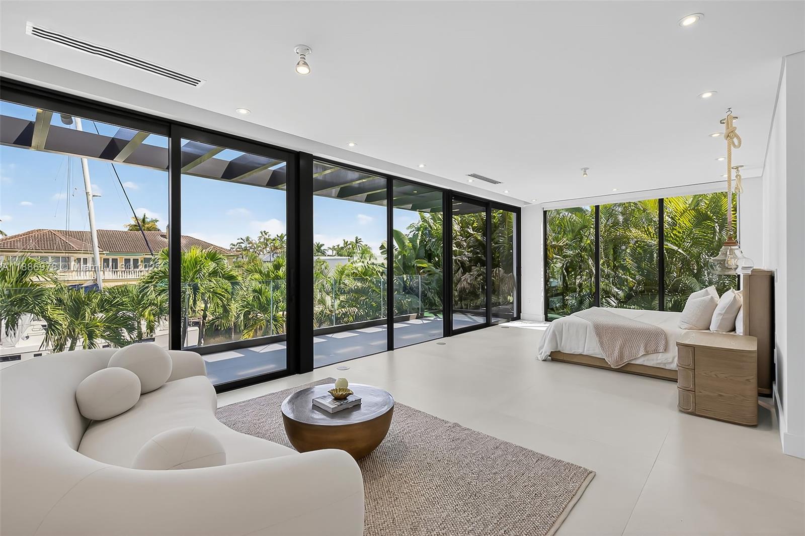 620 Solar Isle Drive Fort Lauderdale, FL 33301 - Photo 41 of 83 a living room with furniture and a large window