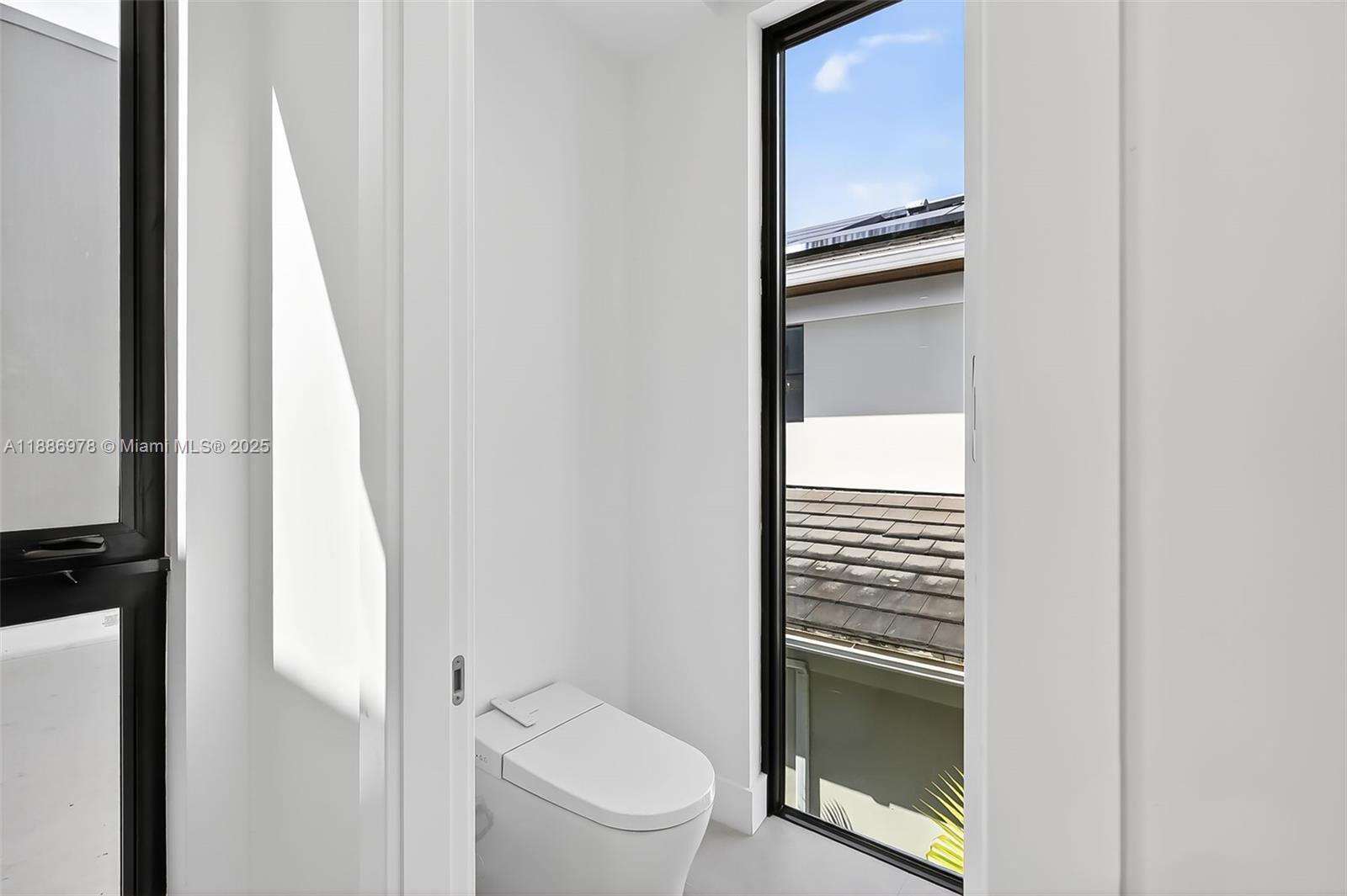 620 Solar Isle Drive Fort Lauderdale, FL 33301 - Photo 50 of 83 a bathroom with a toilet and a sink