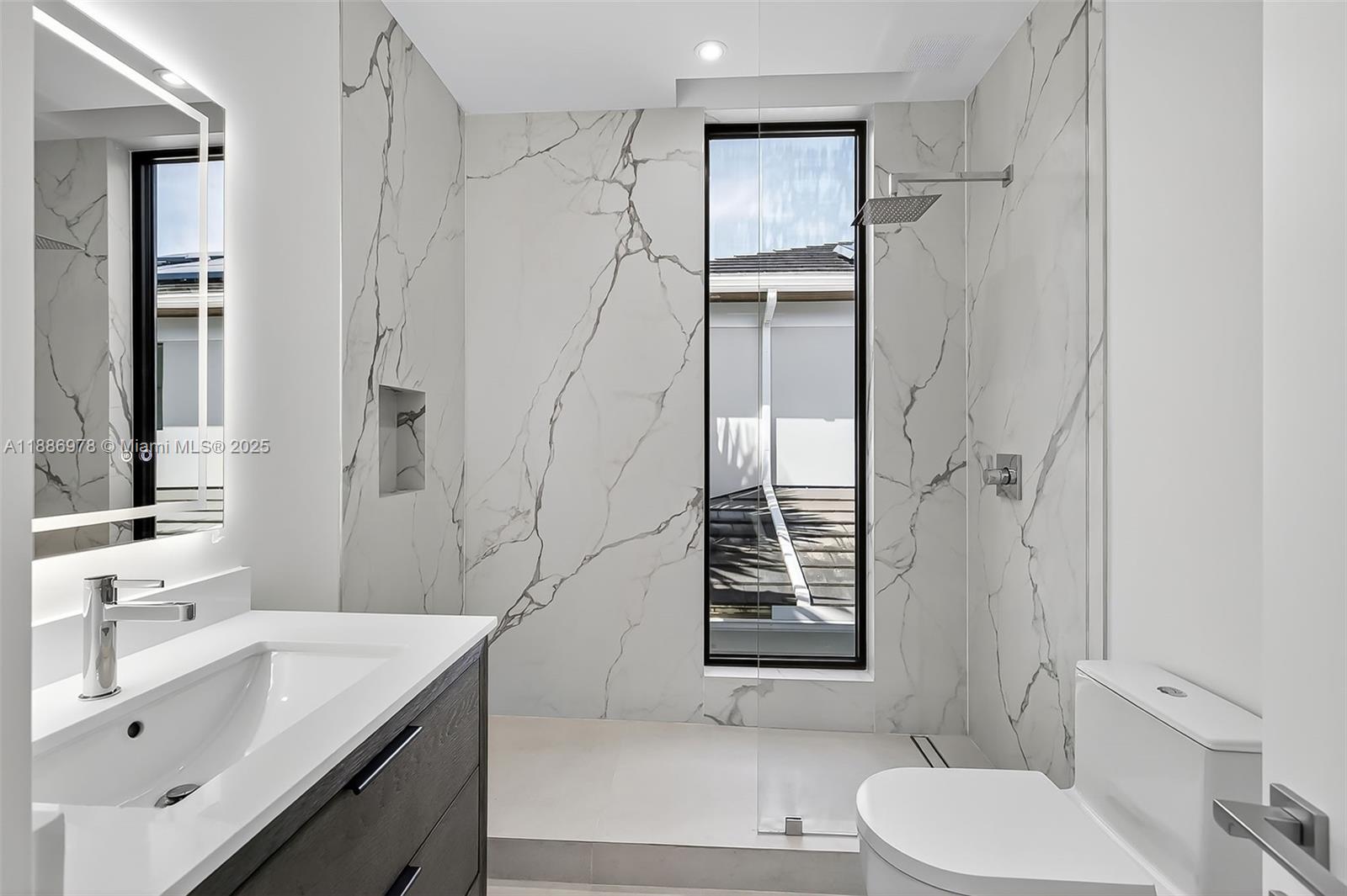 620 Solar Isle Drive Fort Lauderdale, FL 33301 - Photo 55 of 83 a bathroom with a sink toilet and shower