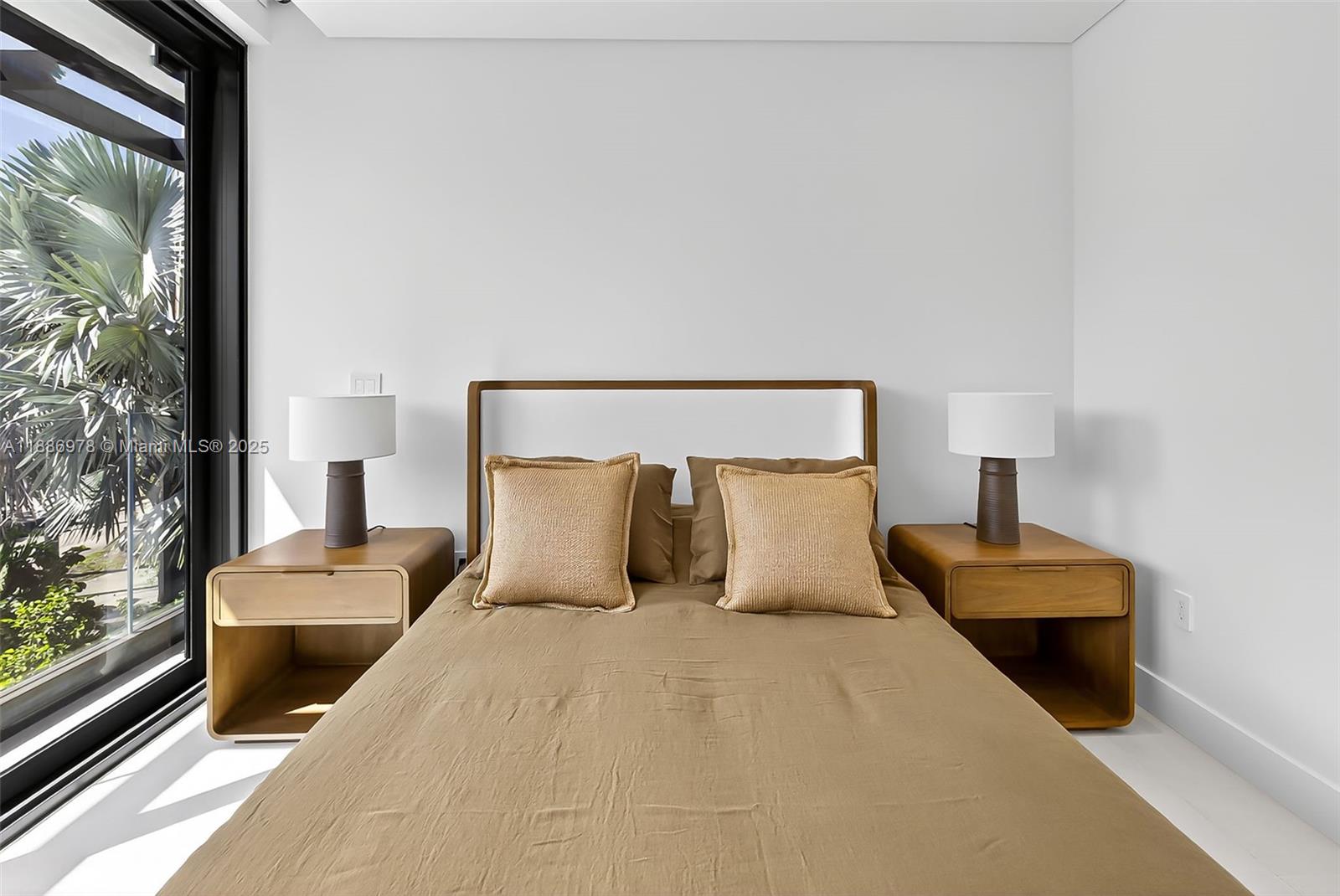 620 Solar Isle Drive Fort Lauderdale, FL 33301 - Photo 63 of 83 a bedroom with a bed and a night stand