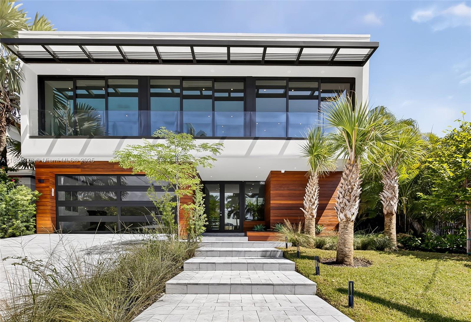 620 Solar Isle Drive Fort Lauderdale, FL 33301 - Photo 7 of 83 a front view of a building with garden