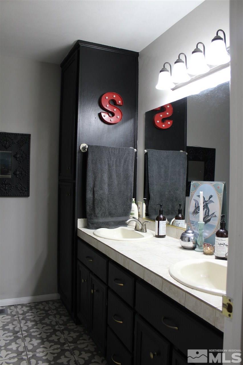 526 Citadel Road Reno, NV 89503 - Photo 15 of 22 a bathroom with a sink and a mirror