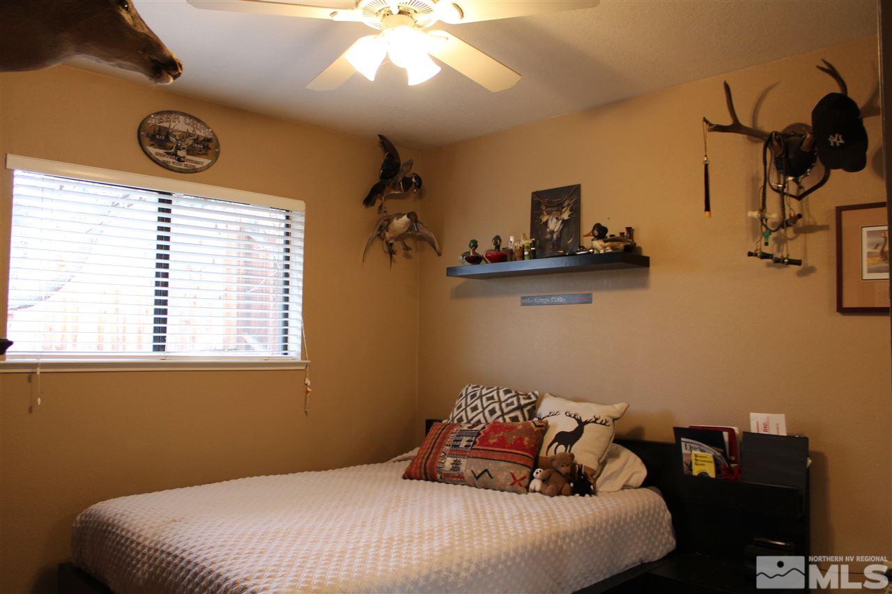 526 Citadel Road Reno, NV 89503 - Photo 16 of 22 a bedroom with a bed and a table