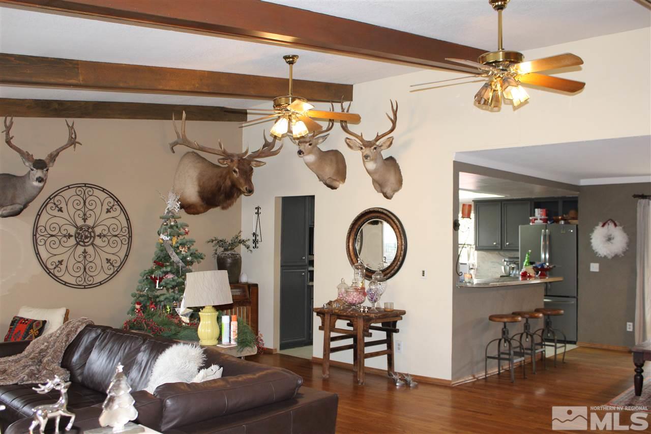 526 Citadel Road Reno, NV 89503 - Photo 2 of 22 a view of a dining room filled with furniture and chandelier