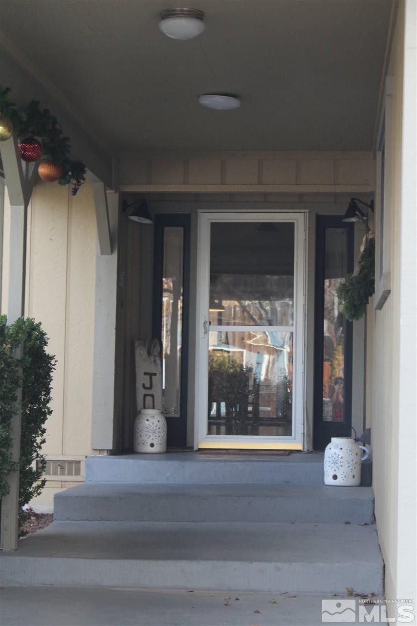 526 Citadel Road Reno, NV 89503 - Photo 22 of 22 a view of a glass door with a glass door and a couch