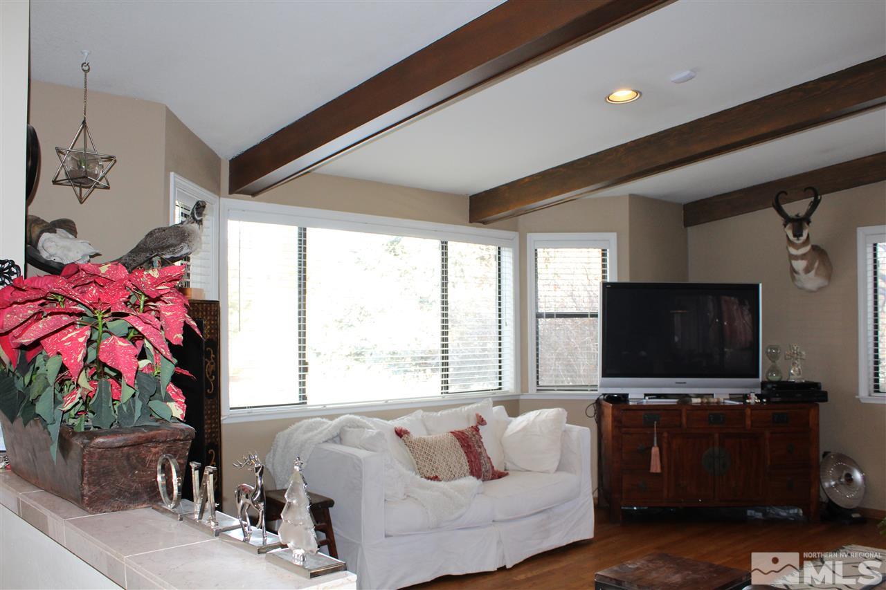 526 Citadel Road Reno, NV 89503 - Photo 3 of 22 a living room with furniture and a flat screen tv