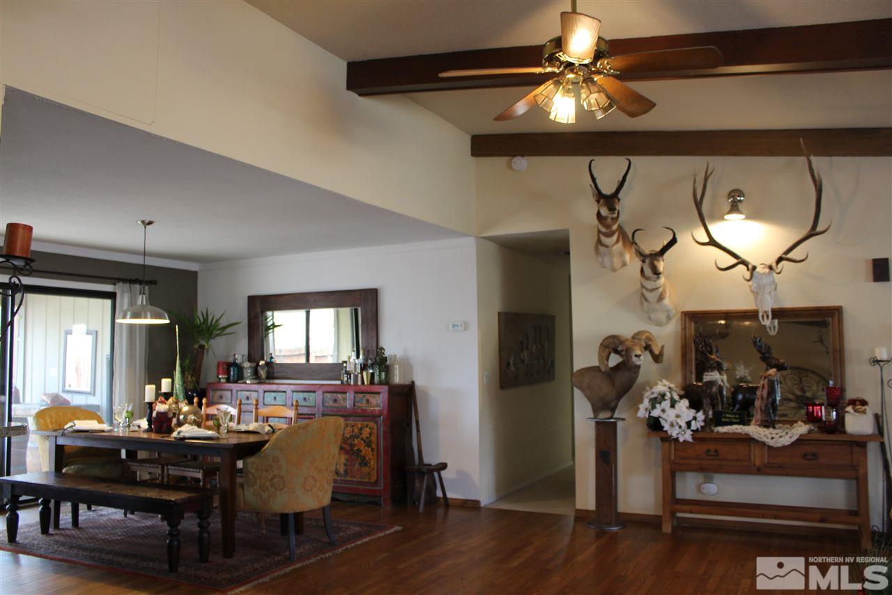 526 Citadel Road Reno, NV 89503 - Photo 4 of 22 a living room with furniture and a chandelier