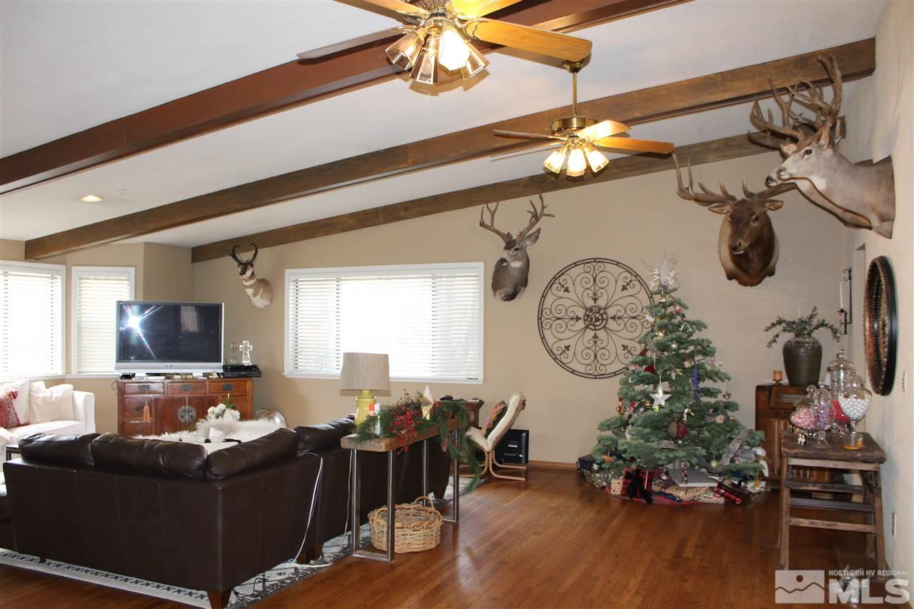 526 Citadel Road Reno, NV 89503 - Photo 5 of 22 a living room with furniture a flat screen tv and a window