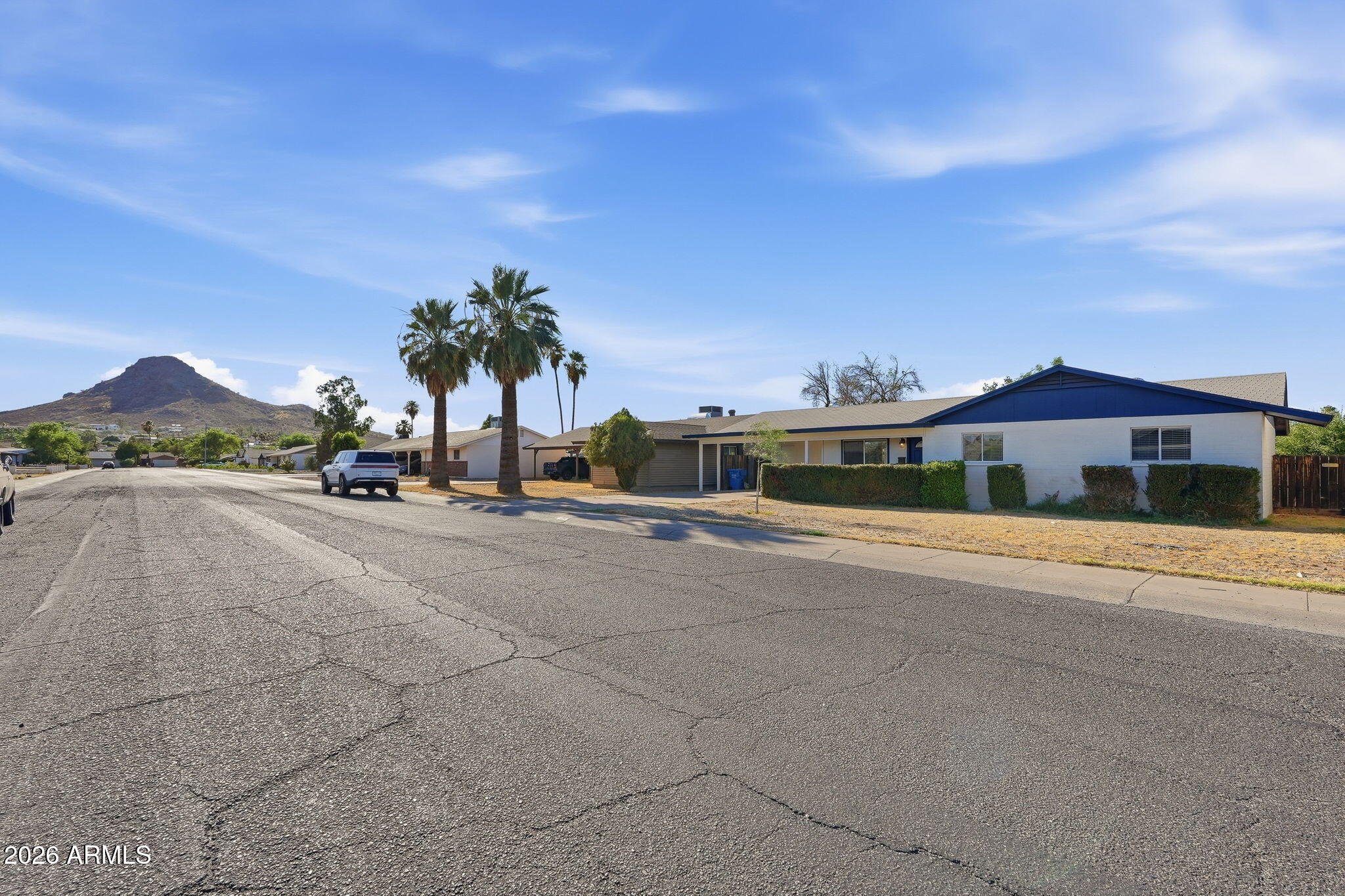 2302 East Nisbet Road Phoenix, AZ 85022 - Photo 2 of 22 a view of a street with a houses