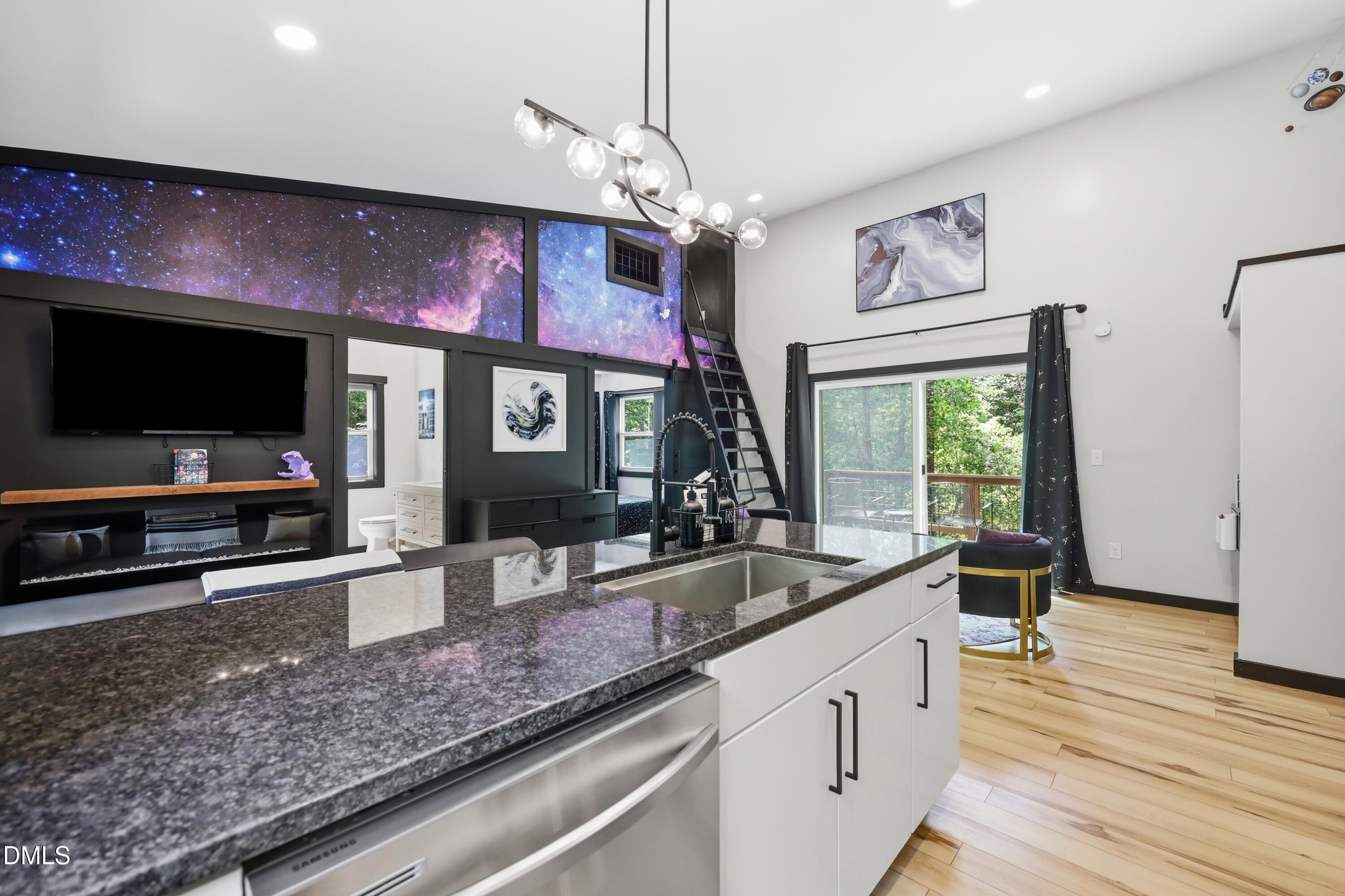 286 Stone Wall Road Pittsboro, NC 27312 - Photo 47 of 71 a kitchen with stainless steel appliances granite countertop a sink and a microwave