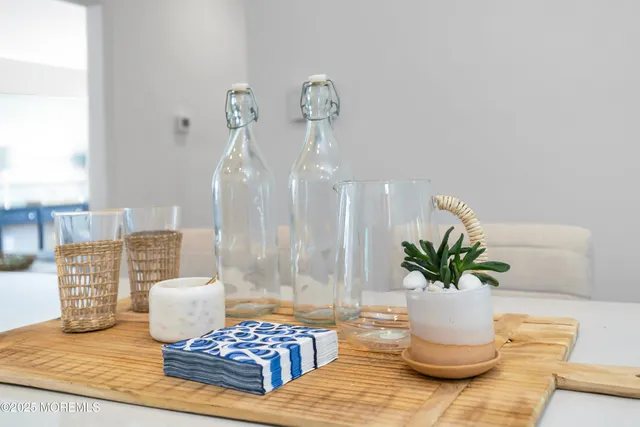 a view of a dining room with furniture and a window
