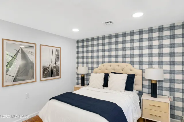 a bedroom with two beds and a couch