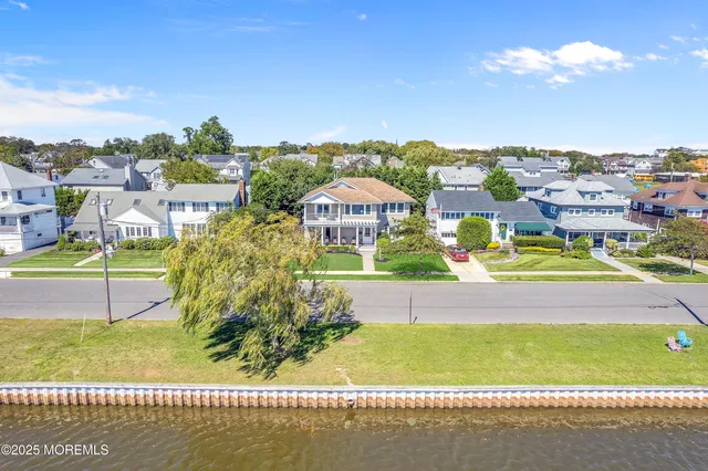 an outdoor space with lots of flowers and trees