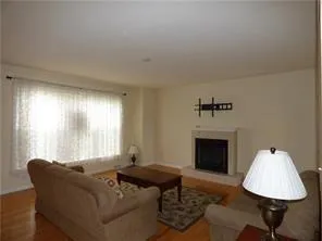 a kitchen with granite countertop a stove top oven a sink a dining table and chairs