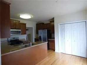 a dining room with furniture a potted plant and a chandelier