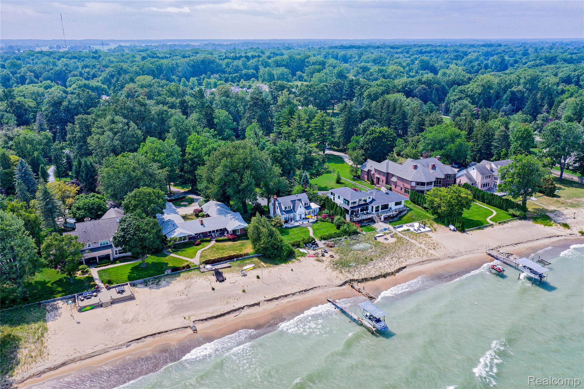 5630 Lakeshore Road Fort Gratiot, MI 48059 - Photo 46 of 49 Private residential properties situated along a sandy beachfront, featuring mature trees and established landscaping