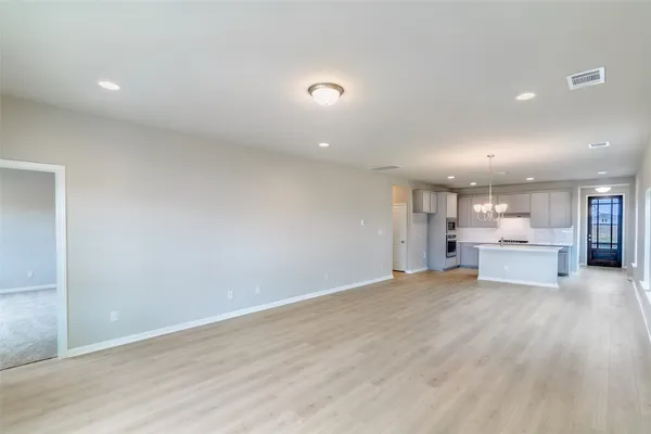 a view of a kitchen with a sink and cabinets