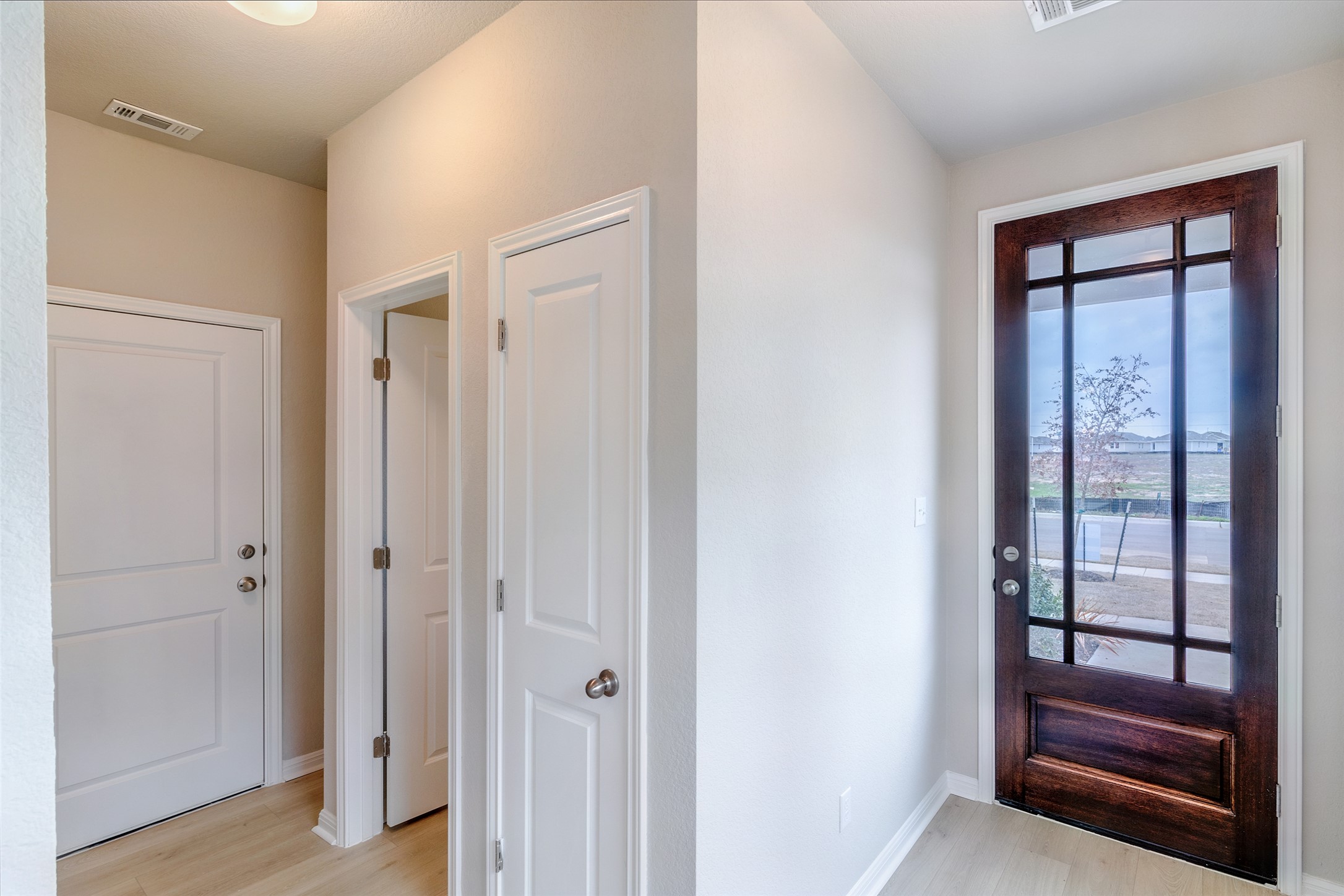 113 Watercourse Way Bastrop, TX 78602 - Photo 13 of 32 a view of front door with a hallway