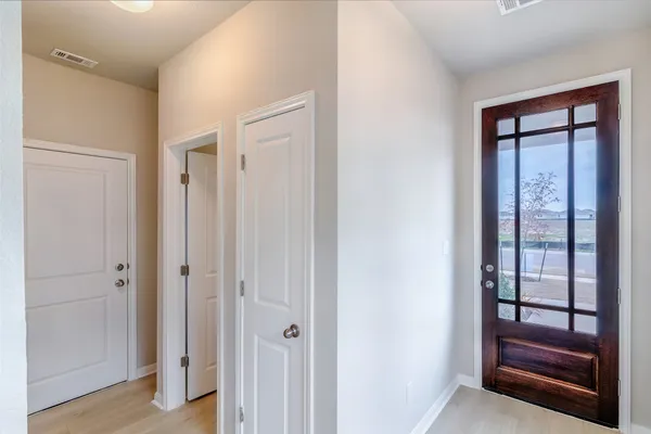 a view of front door with a hallway
