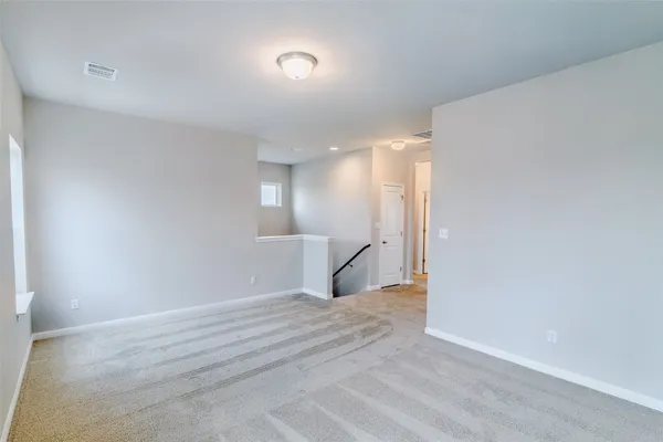 an empty room with window and windows