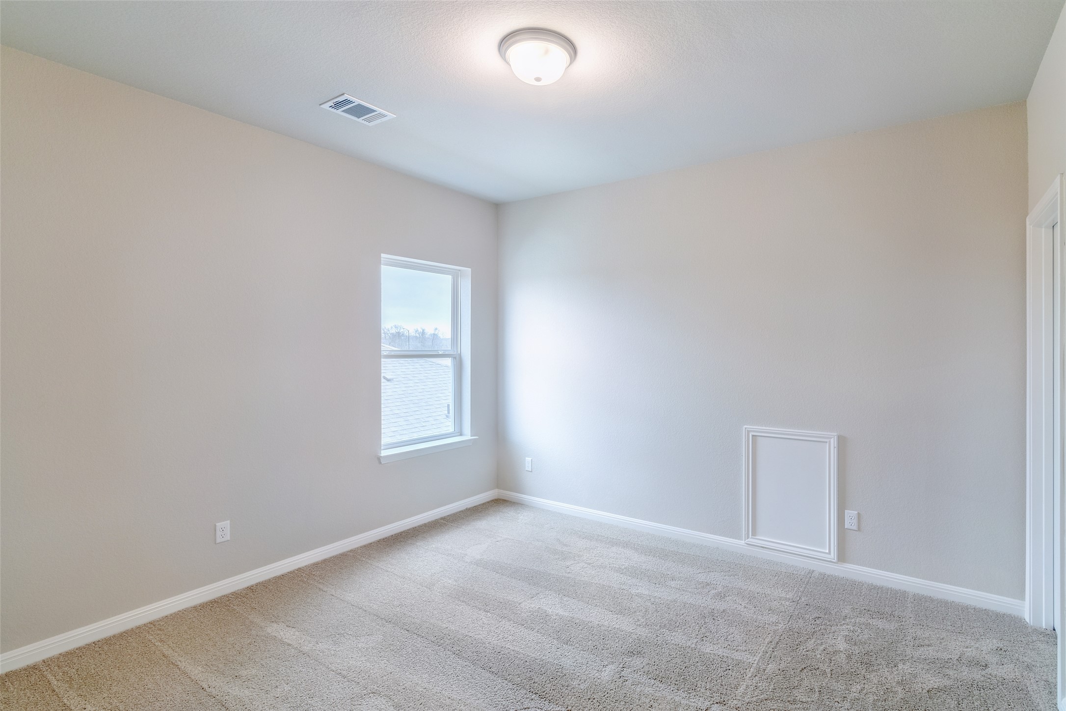 113 Watercourse Way Bastrop, TX 78602 - Photo 23 of 32 an empty room with window and windows