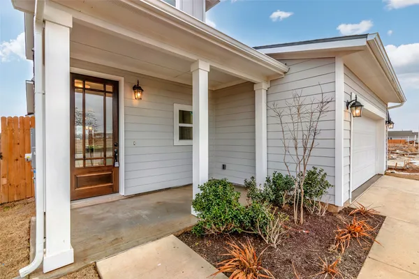 a potted plant sitting in front of a house