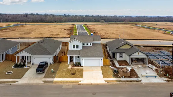 an aerial view of a house with lake view