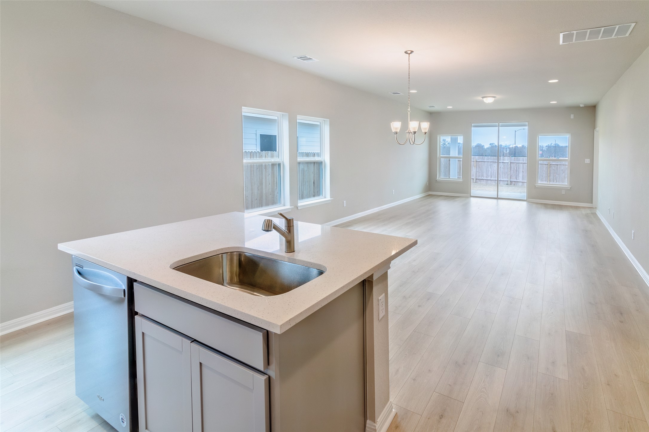 113 Watercourse Way Bastrop, TX 78602 - Photo 8 of 32 a kitchen with a sink and cabinet