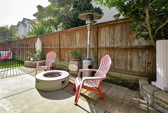 a view of a chair and fire pit in the patio