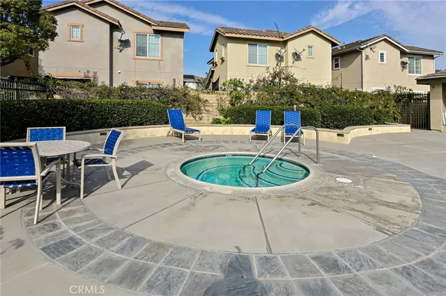 a view of a house with swimming pool and a porch