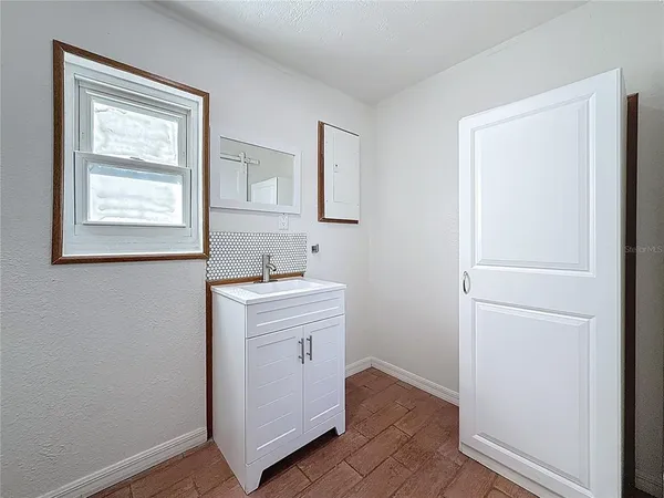 a view of an empty room with a window