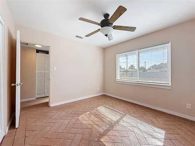 a view of an empty room with a window